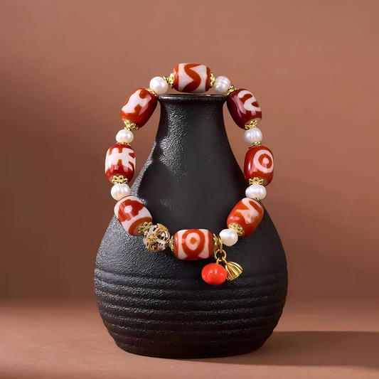 Tibetan Buddhist sacrificial implements culture red meat agate bucket multi-totem Dzi bracelet. Handcrafted from natural agate as a piece of Buddhist sacrificial items art.
