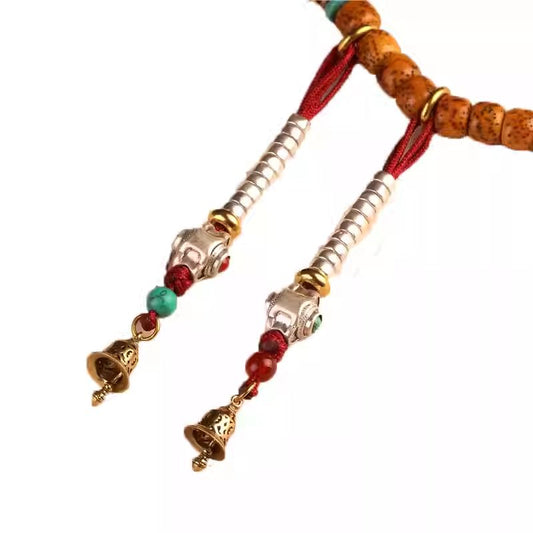 Exquisite vintage Tibetan bell charm, a versatile brass accessory for jewelry art and spiritual practice, bringing peace.