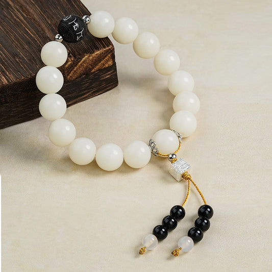 White Bodhi Root Mala featuring 15 hand-carved wooden beads with sacred symbols. This Tibetan Buddhist jewelry culture piece embodies traditional craftsmanship for meditation practice.