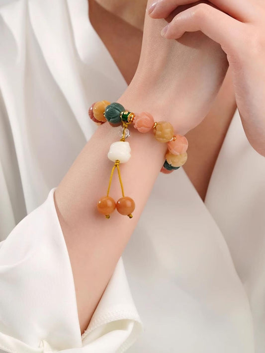 Awareness prayer beads made of bodhi and transparent quartz crystal. This handmade Tibetan Buddhist ornament is an artistic symbol of spiritual awakening.