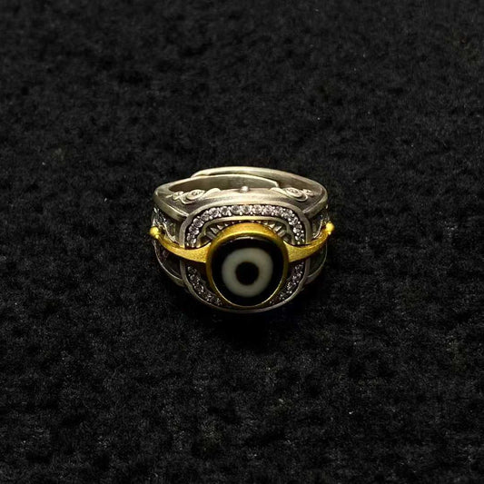 Tibetan Buddhist jewelry culture embodied in a S925 silver mandala ring featuring sacred geometry patterns, representing the cosmic universe in fine jewelry art.