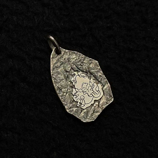 A masterpiece of Tibetan Buddhist jewelry art, this pure gold and silver Mahakala guardian pendant showcases exquisite inlaid craftsmanship for spiritual protection.