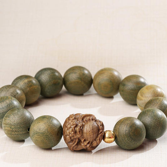 Handmade Tibetan Buddhist mala featuring natural green sandalwood beads with 925 silver accents. This sacred jewelry art combines traditional Tibetan craftsmanship with sterling silver details for meditation and spiritual practice.
