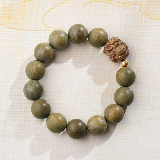 Serene sandalwood silver bracelet handcrafted from green sandalwood and 925 silver beads. This Tibetan Buddhist jewelry art piece embodies peaceful energy and authentic Himalayan metalworking traditions.
