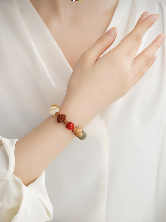 Handcrafted Tibetan Buddhist bracelet made with Bodhi seeds and agate beads, showcasing the spiritual symbolism and craftsmanship of Tibetan jewelry culture.