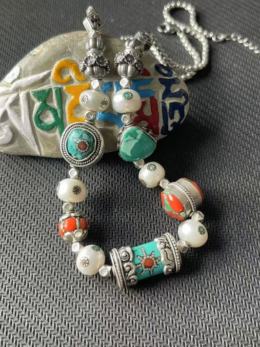 Handcrafted multi-treasure symmetric bracelet, combining Tibetan Buddhist jewelry culture with dazzling colors and elegant design, perfect for a bold, fashionable look.