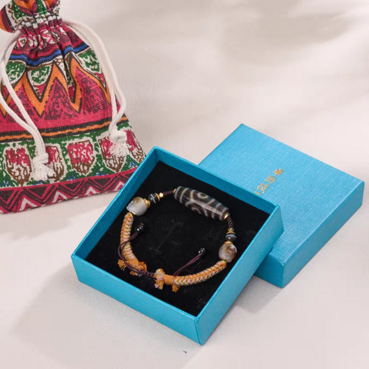 Handmade Tibetan Agate Three-Eye Panda Dzi bracelet, crafted in authentic Tibetan Buddhist jewelry culture and artisan jewelry art.