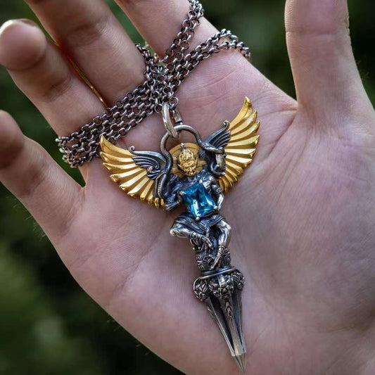 Hand-painted silver four-armed Garuda phurba pendant inspired by Tibetan Buddhist jewelry culture, sacred jewelry art for protection.