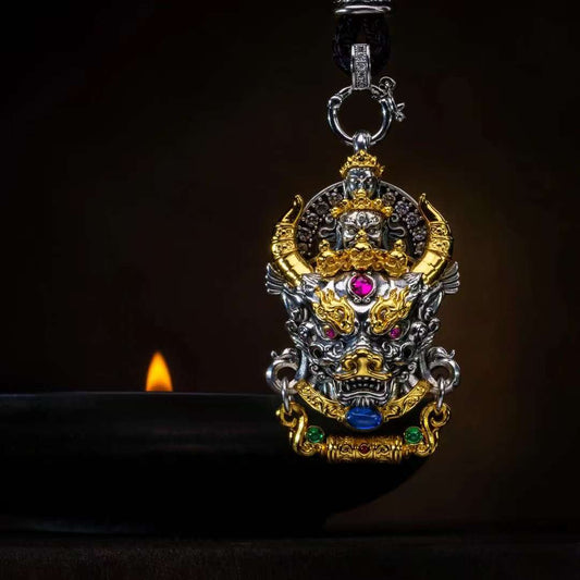 Sacred silver Yamantaka guardian pendant from Tibetan Buddhist jewelry culture, handcrafted spiritual jewelry art.