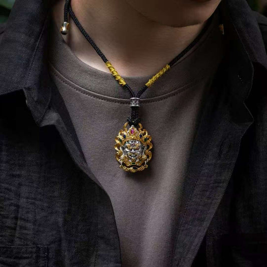 Handmade silver Yellow Jambhala Buddhist pendant, sacred jewelry art representing prosperity and financial blessings.