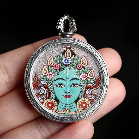 Sacred Zaki Lam Yellow Wealth Buddha Thangka pendant necklace with hand-painted Blue Bodhi Leaf design, offering blessings of abundance and protection