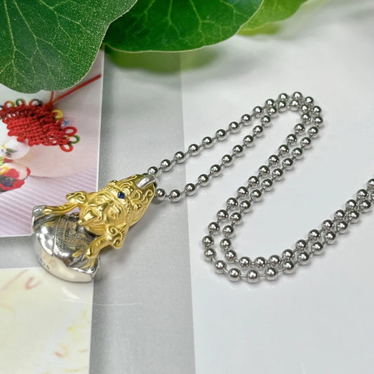 Tibetan Buddhist silver Zaki Lhamo goddess pendant, jewelry art representing prosperity and spiritual protection.