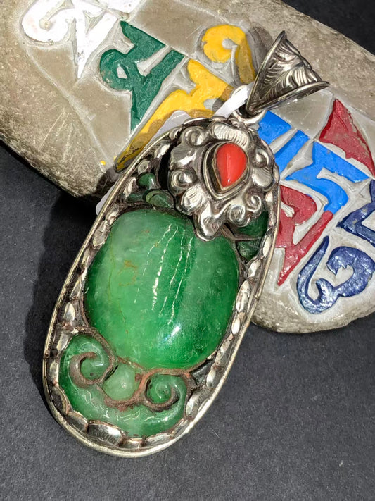 Handcrafted old jade pendant with Tibetan Buddhist influences, symbolizing spiritual growth, protection, and balance. A unique, antique-style accessory.