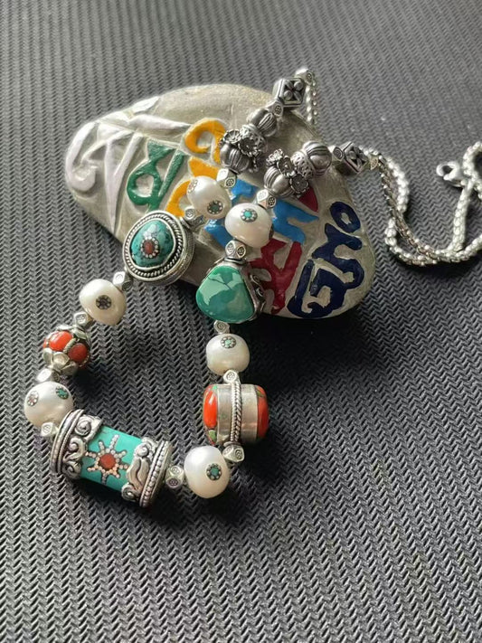 Exquisite handmade bracelet featuring multi-treasure symmetric design, showcasing the rich symbolism of Tibetan Buddhist jewelry culture with modern artistry.