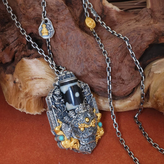 Handcrafted silver Mahakala and Green Tara pendant inspired by Tibetan Buddhist jewelry culture, symbolic jewelry art for protection and compassion.