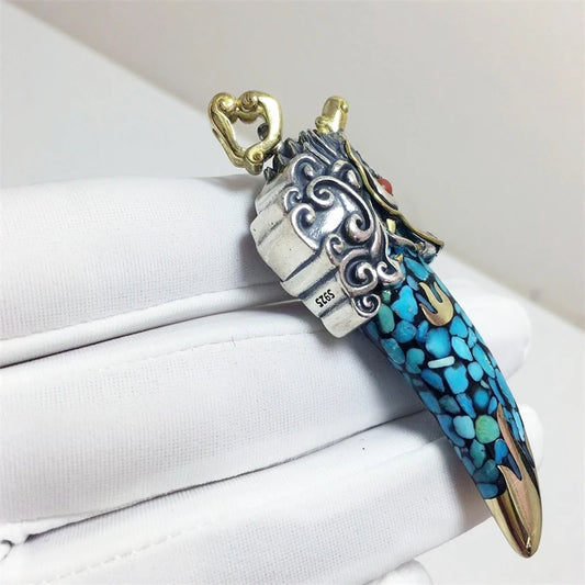 Tibetan Buddhist Jewelry Culture Handcrafted silver dragon tooth necklace inspired by Tibetan Buddhist jewelry culture, symbolic jewelry art for protection and strength.