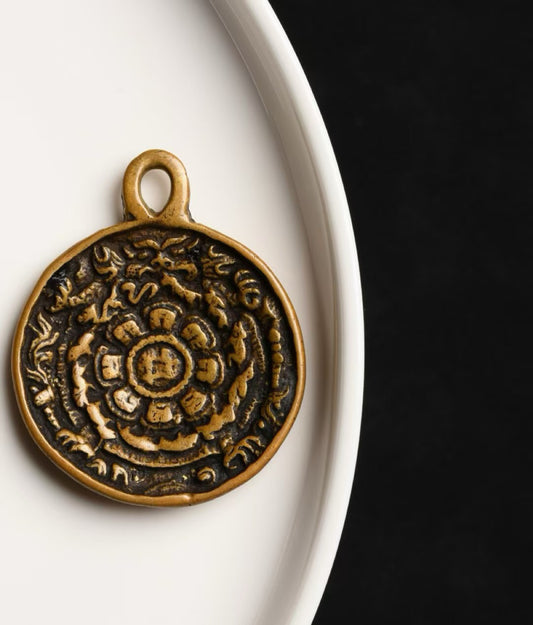 Hand-painted Armored Bear Nine Palace pendant inspired by Tibetan Buddhist jewelry culture, symbolizing protection and grounding energy.