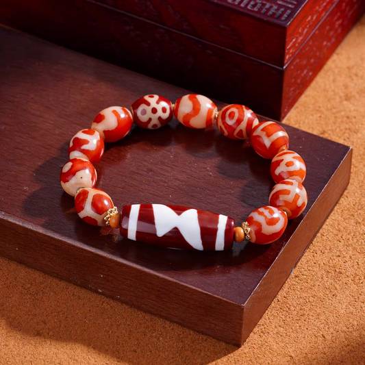 Handmade Tibetan Buddhist red coral multi-stone wrist mala, a fine example of Tibetan Buddhist jewelry culture and artisan craftsmanship.