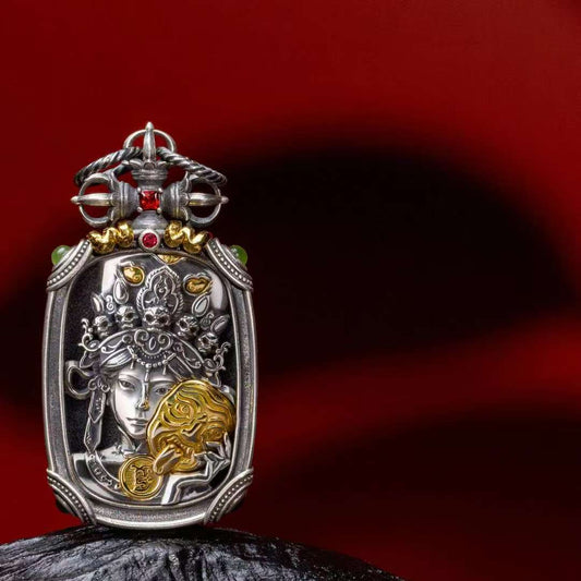 Handmade silver Ten Symbols Buddhist pendant representing Tibetan Buddhist jewelry culture and sacred jewelry art.