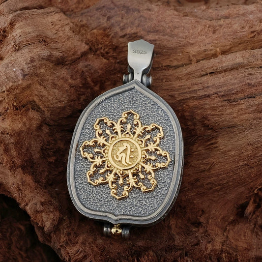 Handmade silver gilded guardian deity pendant combining Yellow Jambhala and Ksitigarbha symbolism.