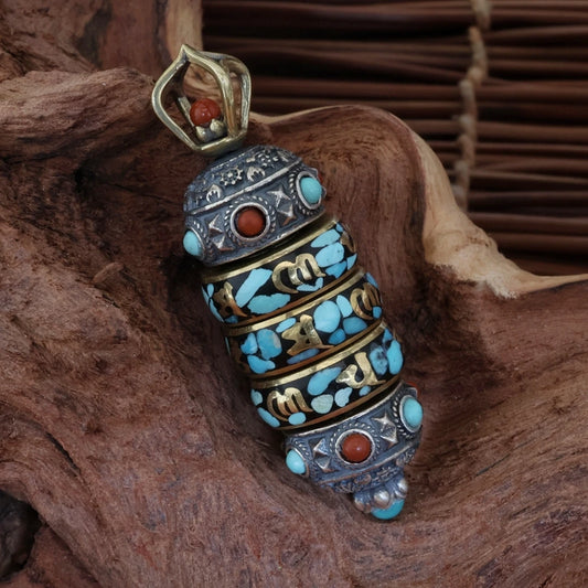 Hand-painted silver six-word mantra rotating pendant inspired by Tibetan Buddhist jewelry culture and sacred jewelry art.