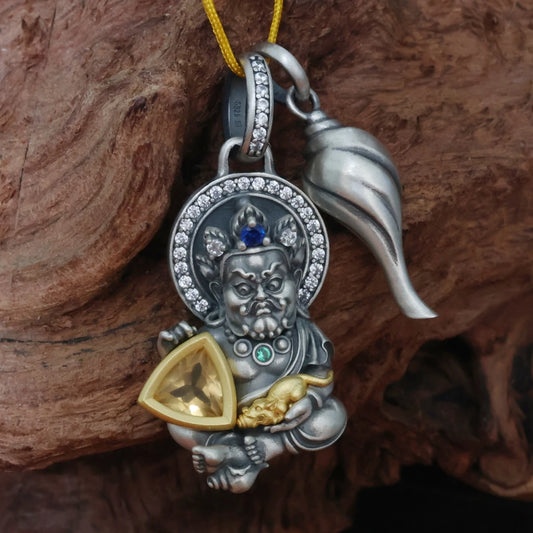 Handmade silver dual deity pendant from Tibetan Buddhist jewelry culture, sacred jewelry art for protection and prosperity.