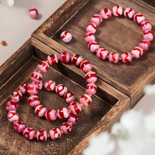 Handmade Tiger Tooth Three-Eye Dzi Beads Bracelet, inspired by Tibetan Buddhist Jewelry Culture, promotes fortune, protection, and positive energy.”