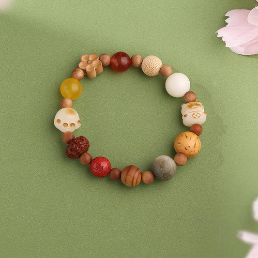 Handcrafted Tibetan mala beads made with Bodhi, cinnabar, and glass beads, perfect for meditation and spiritual growth, reflecting the richness of Tibetan Buddhist jewelry art.