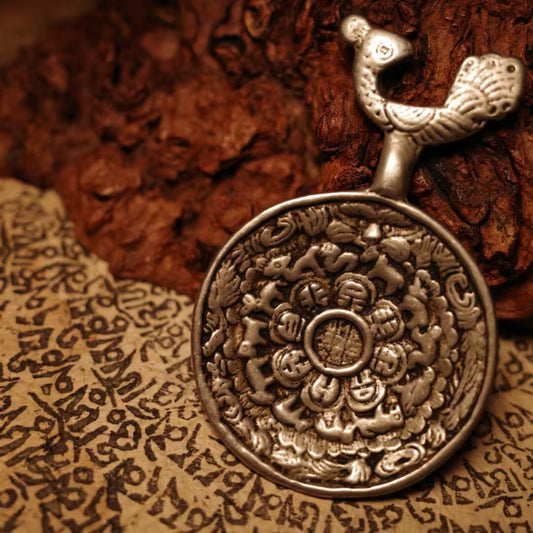 Handcrafted Tibetan Peacock King Nine Palace Bagua pendant inspired by Tibetan Buddhist Jewelry Culture, pure hand-painted Jewelry art symbolizing protection, wisdom, and spiritual purification.