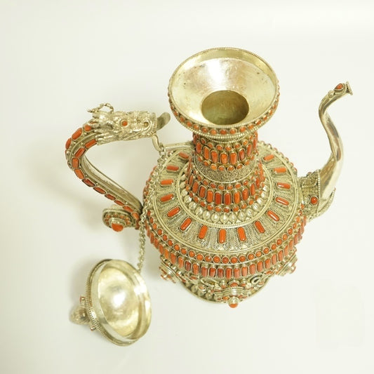 Handmade pure silver coral purification water pot from Tibetan Buddhist ritual implements culture, crafted as refined Buddhist ritual implements art for sacred cleansing rituals.