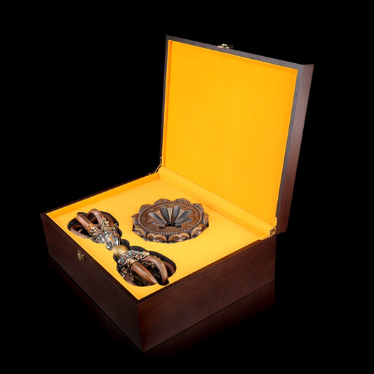 Handcrafted from brass, copper, and white copper, this 33cm Nine-Pronged Vajra with base is a powerful symbol of Tibetan Buddhist wisdom and protection, perfect for home shrines or meditation altars.