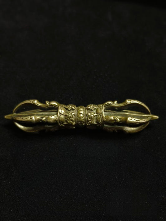 Handcrafted brass five-pronged Vajra, symbolizing strength, wisdom, and spiritual protection. A powerful tool for Tibetan Buddhist rituals, perfect for enhancing your spiritual practice and home décor
