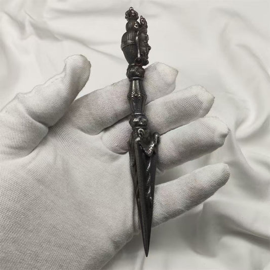 Handcrafted brass Phurba Vajra from Tibetan Buddhist ritual implements culture, symbolizing protection, power, and sacred Buddhist ritual art.