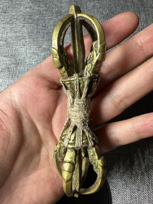 Enhance your spiritual practice with this handcrafted brass Vajra, showcasing an authentic old-world charm with a unique natural patina finish. Ideal for rituals, meditation, and as a decorative piece in sacred spaces.
