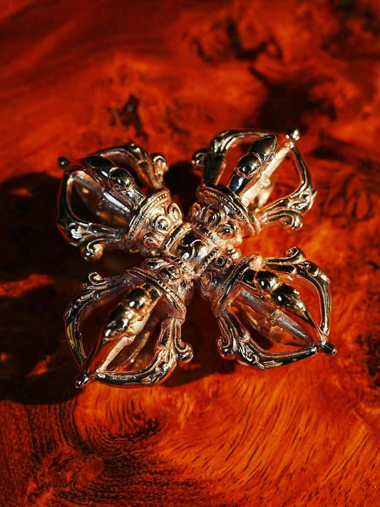 A powerful and sacred brass Cross Vajra, handcrafted to provide protection and wisdom in your spiritual practices. Ideal for Tibetan Buddhist altars, meditation spaces, or as a decorative spiritual piece.