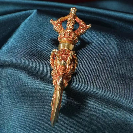 Handcrafted brass Vajra with a human face, embodying the power and protection of Tibetan Buddhist ritual art. Ideal for rituals, meditation, and as a sacred decorative piece for your altar or spiritual space.