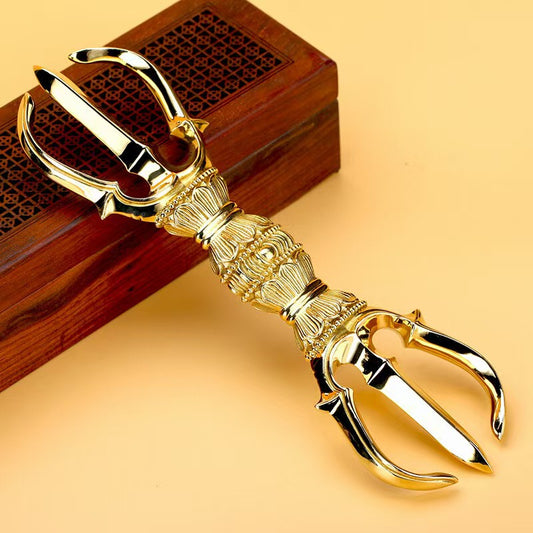 Handcrafted Brass Three-Prong Vajra, representing spiritual empowerment and enlightenment in Tibetan Buddhism. Ideal for meditation, rituals, and sacred spaces