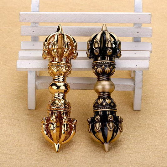 Brass Nine-Pronged Vajra Bell, a handcrafted ritual tool for spiritual purification and protection in Tibetan Buddhism. Ideal for meditation, rituals, and Buddhist altars.