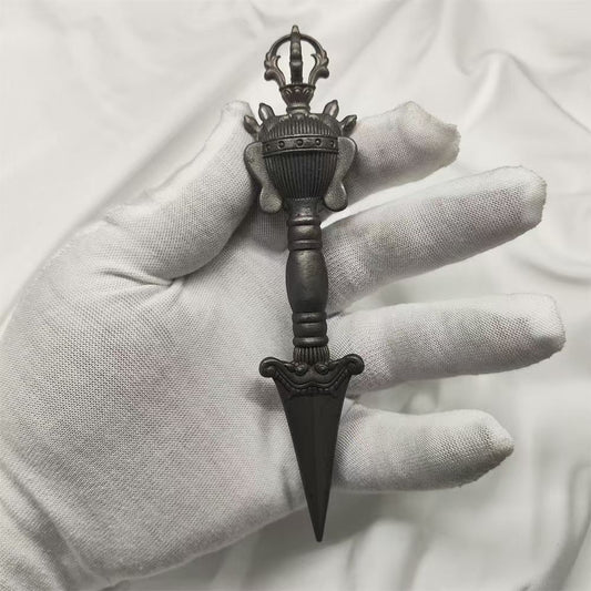 Handcrafted brass Phurba, designed for East Tibetan mantra rituals, symbolizing purification, protection, and spiritual transformation through its powerful design.