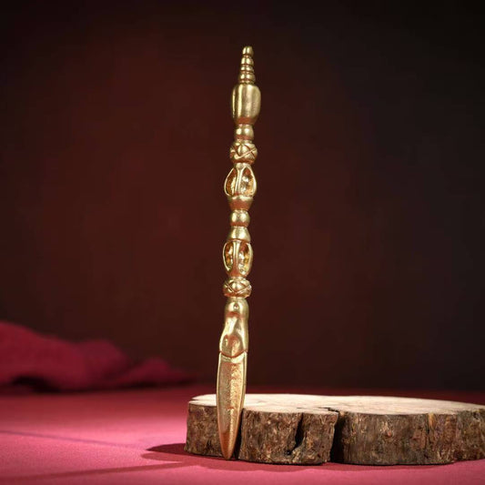 Brass Phurba with Buddha's gesture, symbolizing peace, compassion, and spiritual wisdom. Handcrafted for use in meditation and rituals, a meaningful piece for any spiritual space.