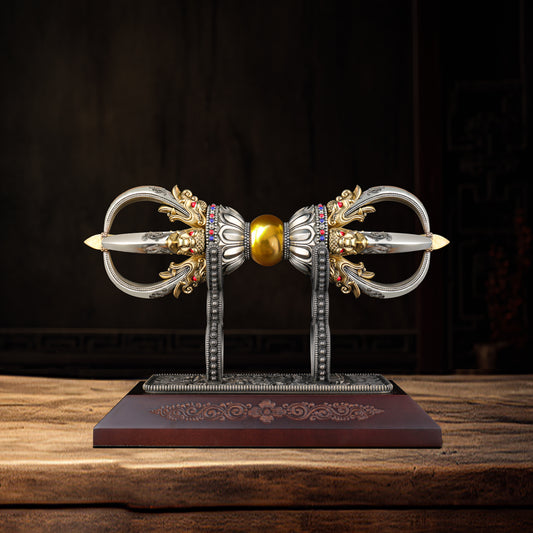 This 28cm Vajra art sculpture is handmade from brass and white copper, embodying the deep cultural and spiritual essence of Tibetan Buddhism. A stunning piece of craftsmanship that serves as a valuable religious or home decoration.