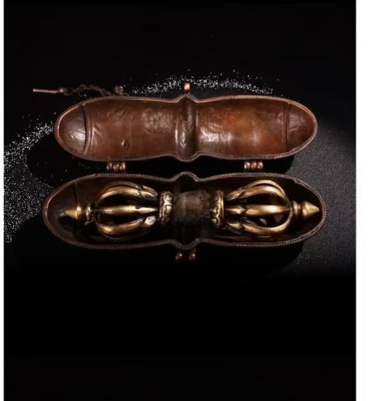Experience the power and symbolism of this copper nine-pronged Vajra handcrafted in Nepal. This antique brass Phurba dagger is a sacred Tibetan Buddhist ritual tool used for protection, purification, and spiritual enlightenment. It is perfect for meditation, rituals, and adding a unique spiritual artifact to your collection. Enhance your Buddhist altar or sacred space with this authentic handcrafted ritual tool.