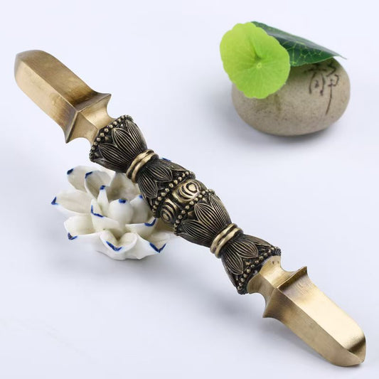 Exquisite handcrafted brass single-prong Vajra, a powerful symbol of wisdom and protection. Ideal for spiritual practices, home altars, or as a decorative cultural artifact.