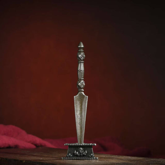 Tibetan Buddhist wrathful Phurba Vajra ritual implement crafted from brass, rooted in Tibetan Buddhist ritual implements culture and Buddhist ritual implements art.