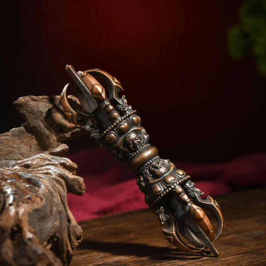 Antique-style Tibetan Buddhist ritual implements culture Phurba Vajra, symbolizing protection, wisdom, and ritual power.