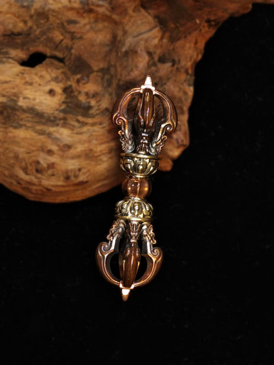 Handcrafted brass phurba vajra, inspired by Tibetan Buddhist ritual implements culture, symbolizing spiritual protection and power in Buddhist ritual implements art.
