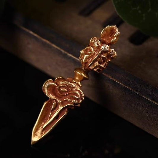 Nepali handcrafted brass three-faced Phurba with horse Vajra, reflecting Tibetan Buddhist ritual implements culture and traditional Buddhist ritual implements art.