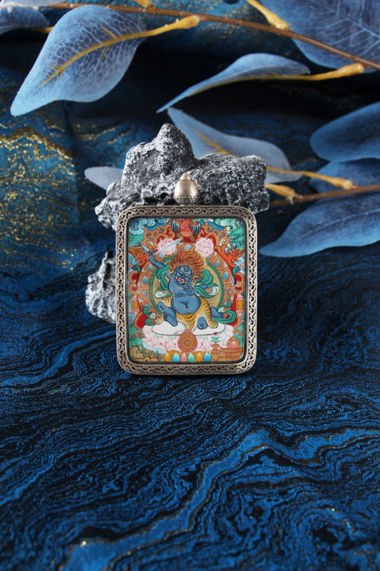 A collector-grade 4x5cm hand-painted Acala (Budong Mingwang) Thangka in Menri style, featuring the Immovable Lord in a silver Nine-Colored Deer frame.