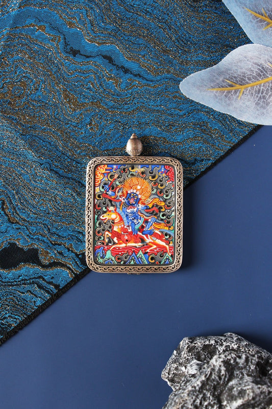 A 4x5cm hand-painted Palden Lhamo Thangka in Miansa style, featuring pure gold powder and mineral pigments in a silver frame.
