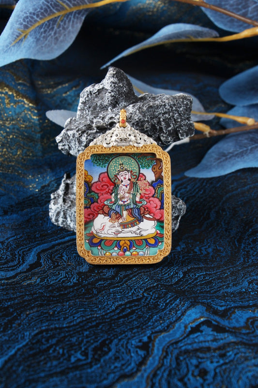 A 3.5x4.5cm high-end hand-painted Samantabhadra (Pu Xian) Thangka from Rebgong, the guardian for Zodiac Dragon and Snake, in a silver protective frame.